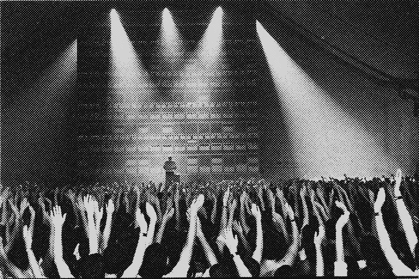 Halftone wire photo: a congregation with dozens of raised hands before a glowing wall of server racks, a lone preacher silhouetted at center
